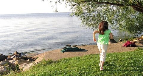 Lakeside - Wandering image child running by a lake