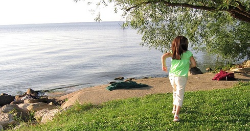 Lakeside - Wandering image child running by a lake